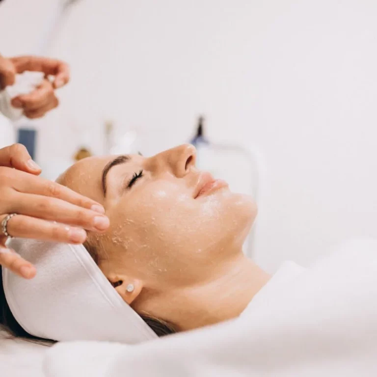 cosmetologist-cleaning-face-woman-beauty-salon-scaled-1